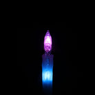 A flowlight is glowing, half of it is purple and half is blue, it looks bright.