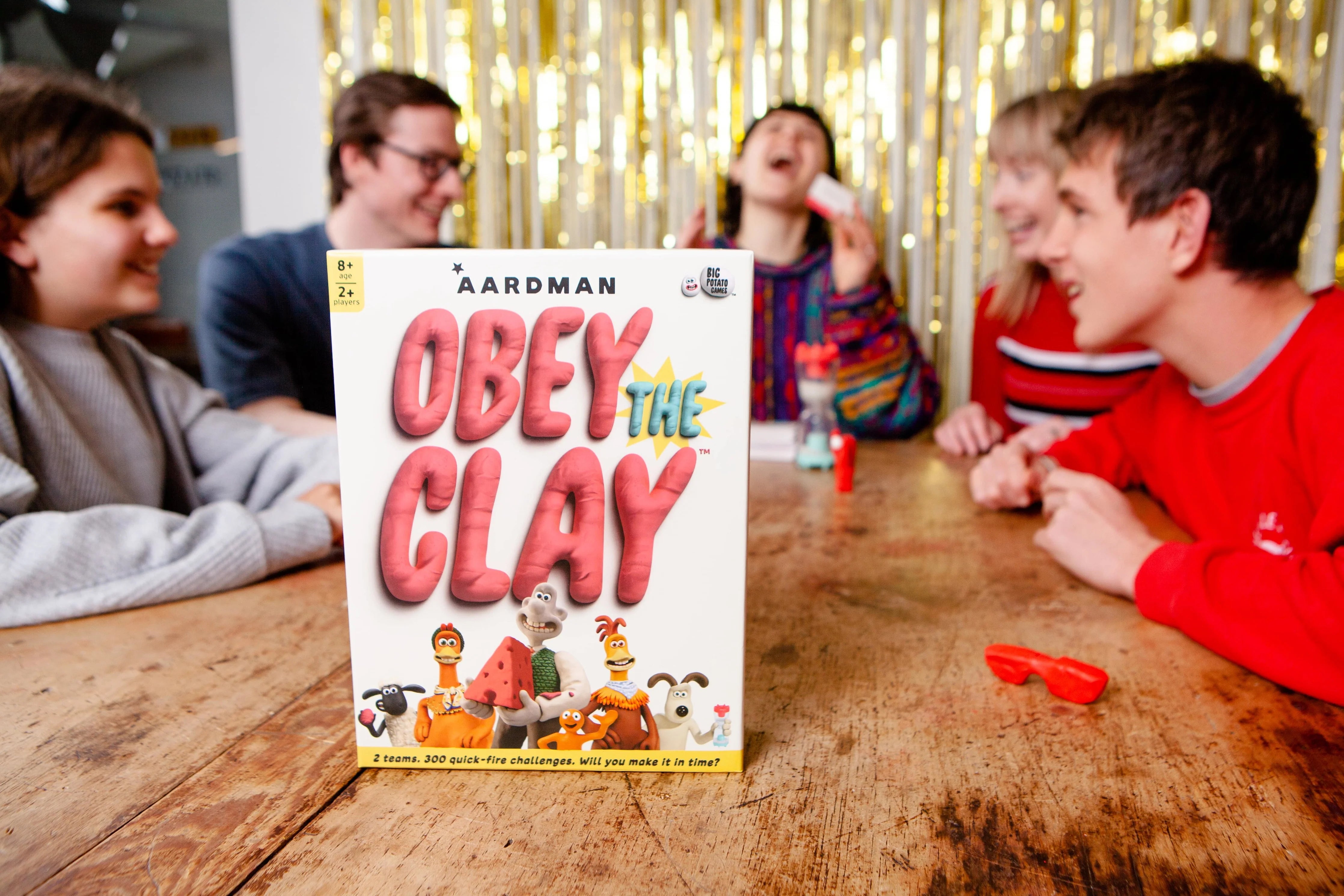 group playing obey the clay