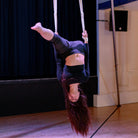 performer using cotton covered aerial straps