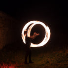 performer with fire poi