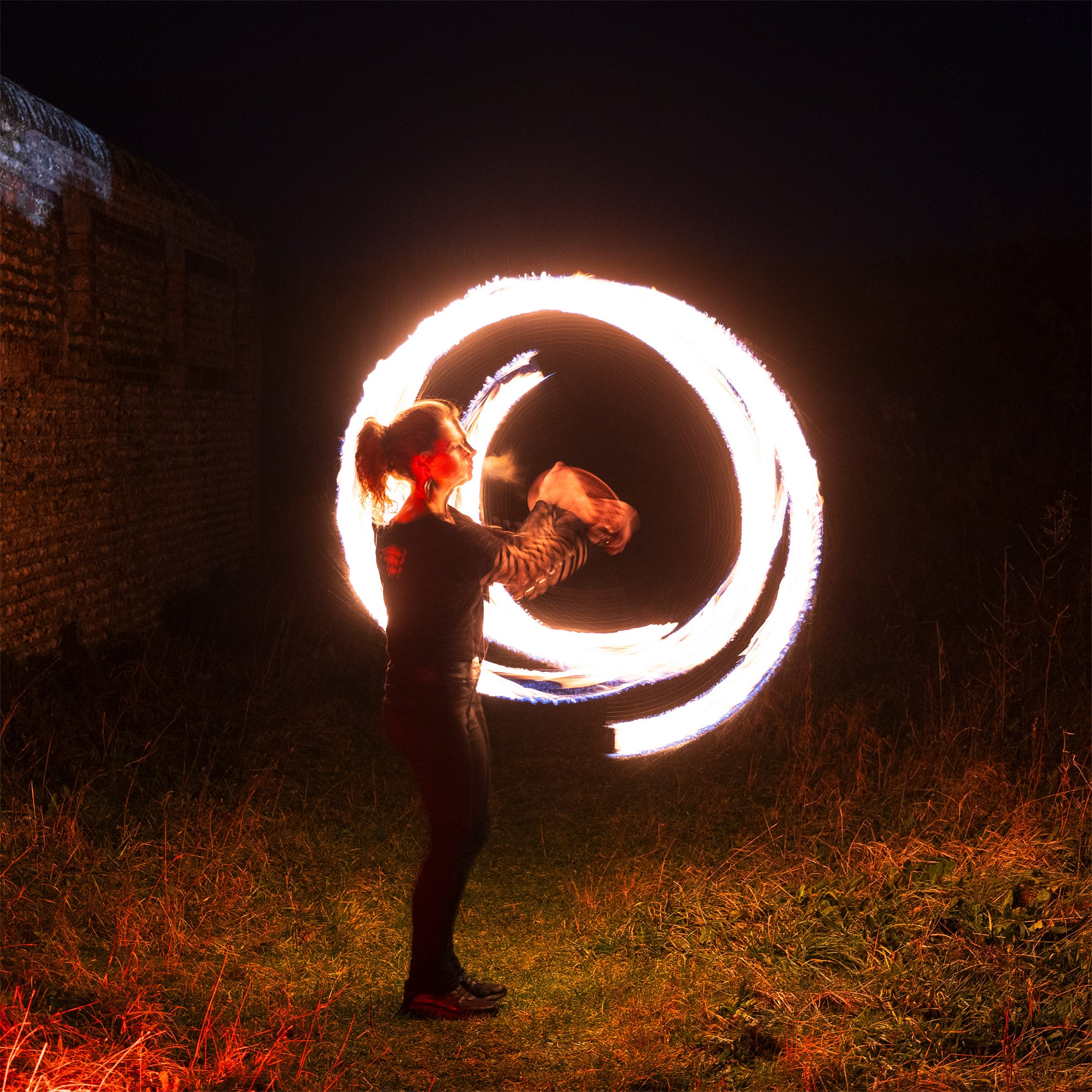 performer with fire poi