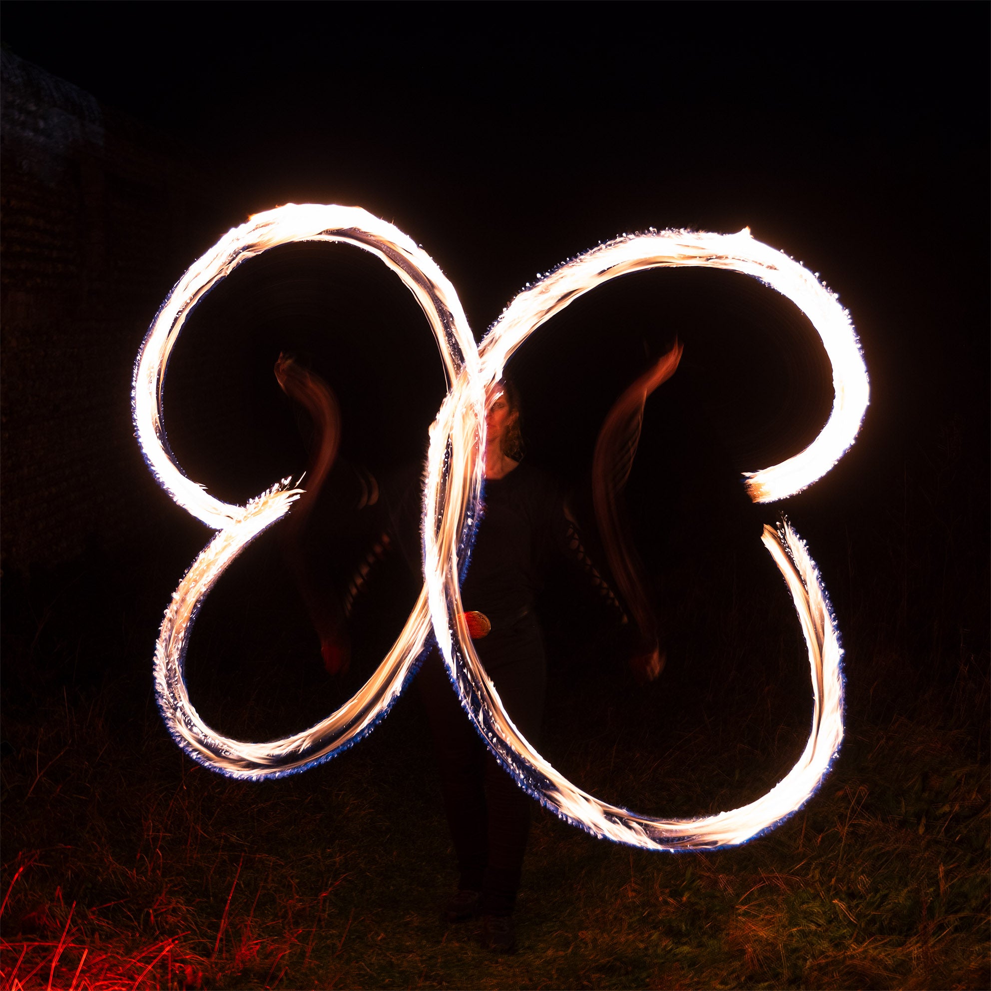 performer with fire poi