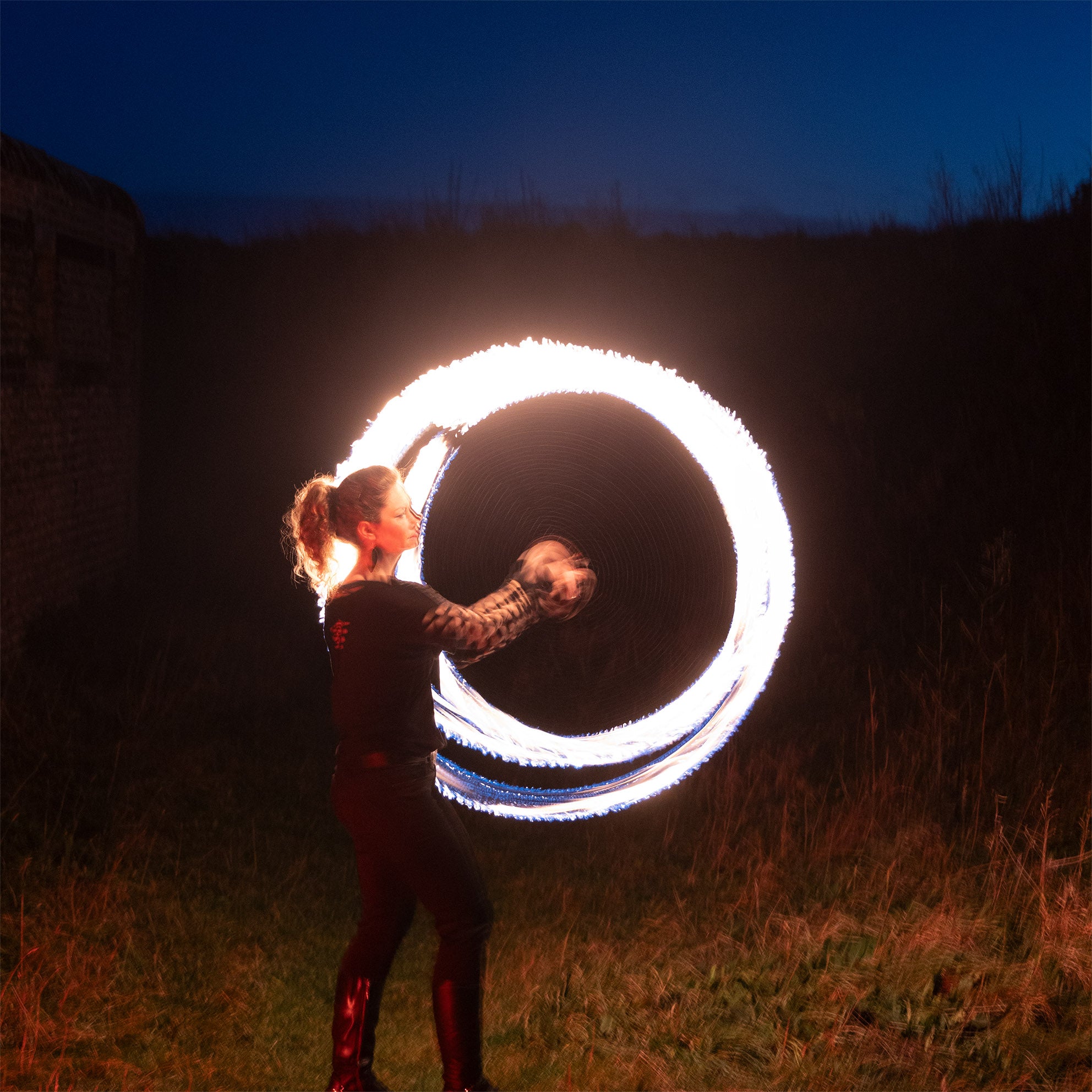 performer with fire poi