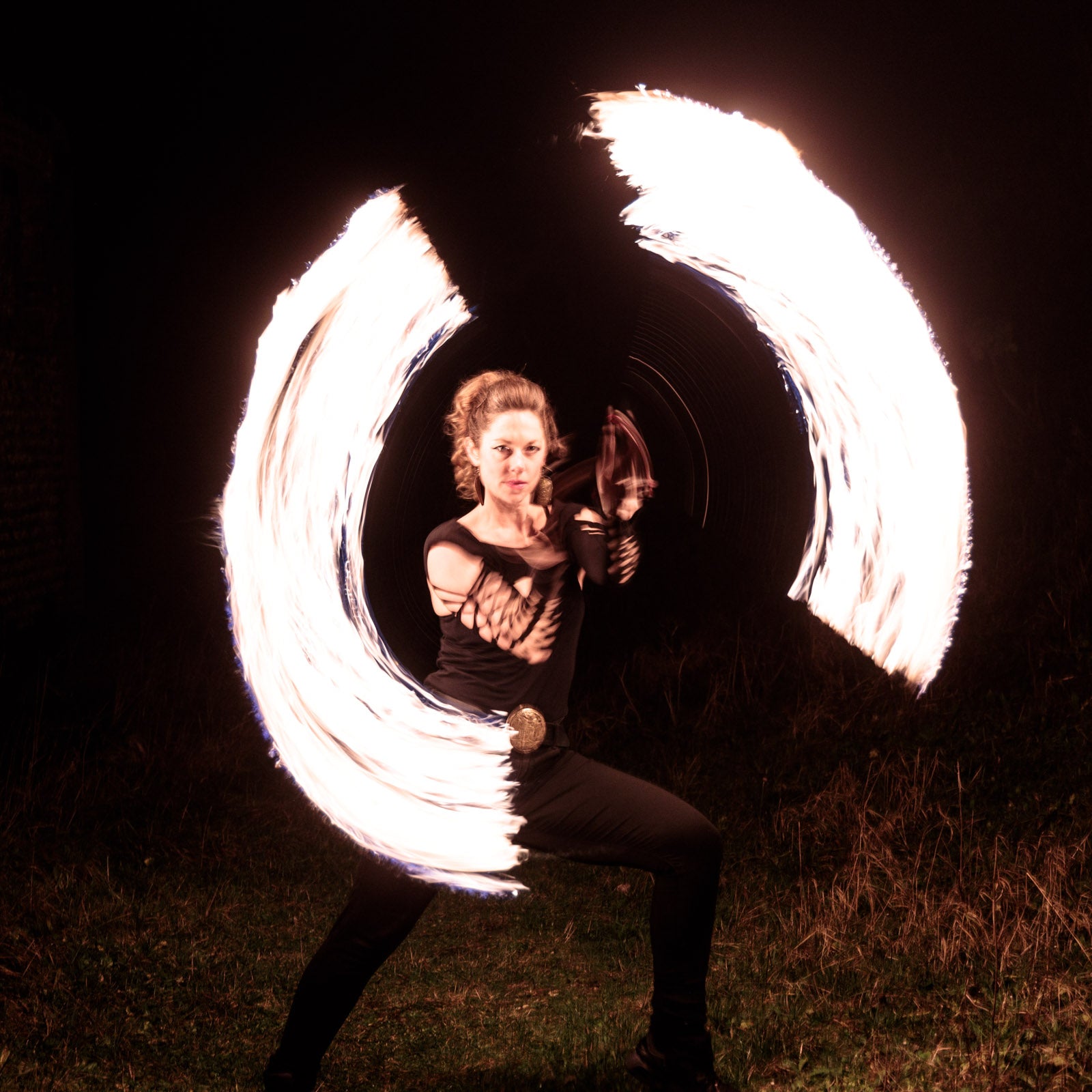 performer with fire poi