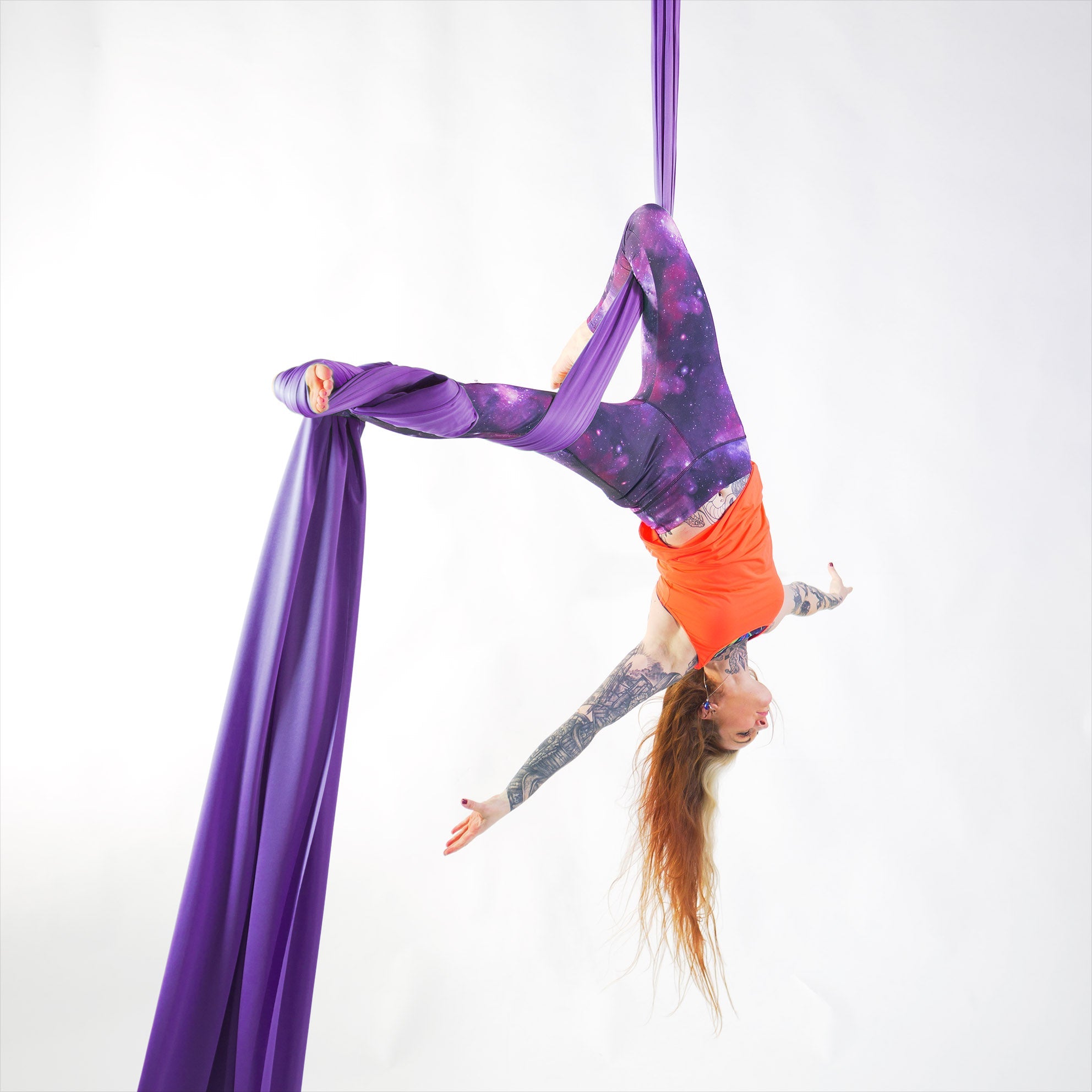 performer on purple silks