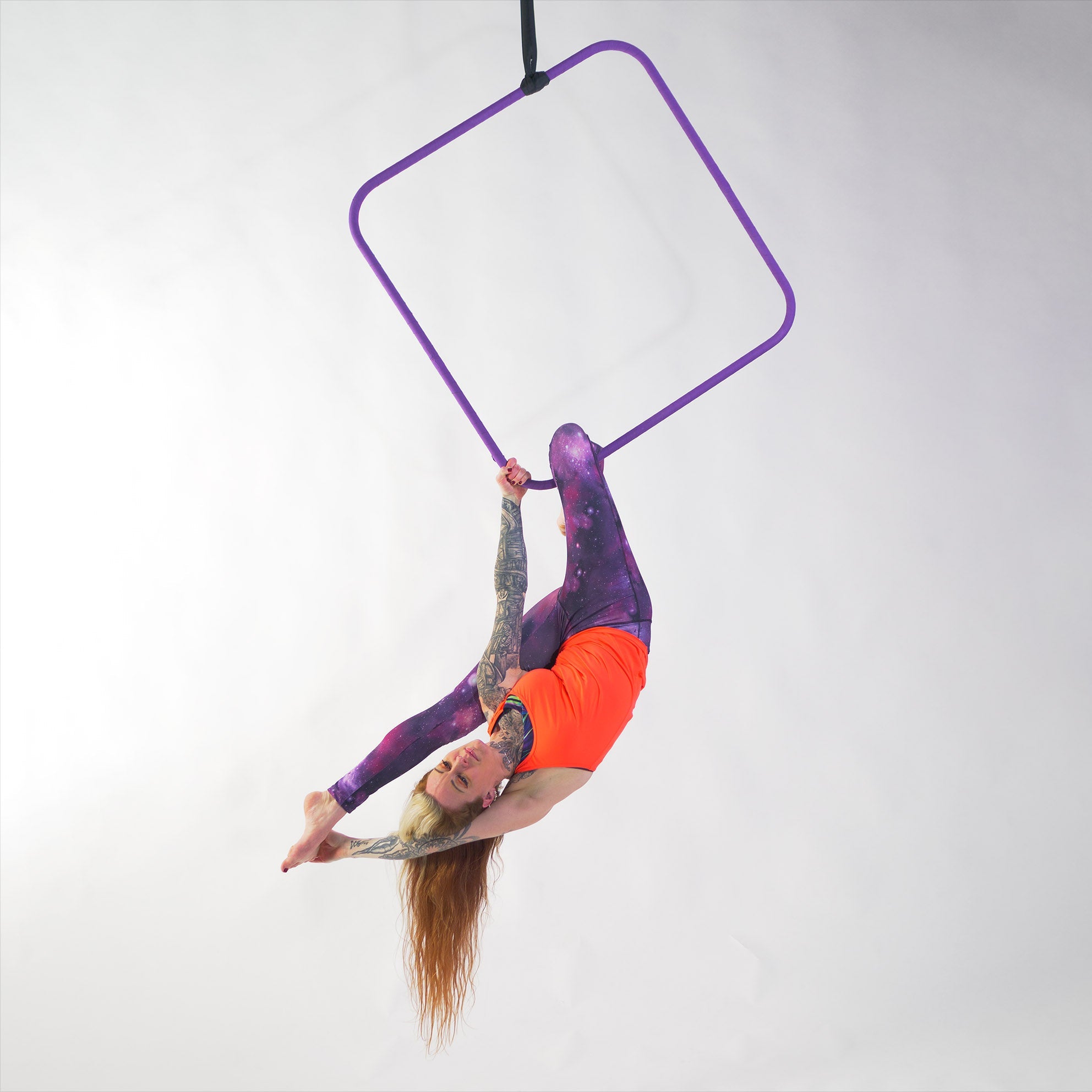 performer hanging from aerial square