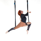 performer on shackle trapeze